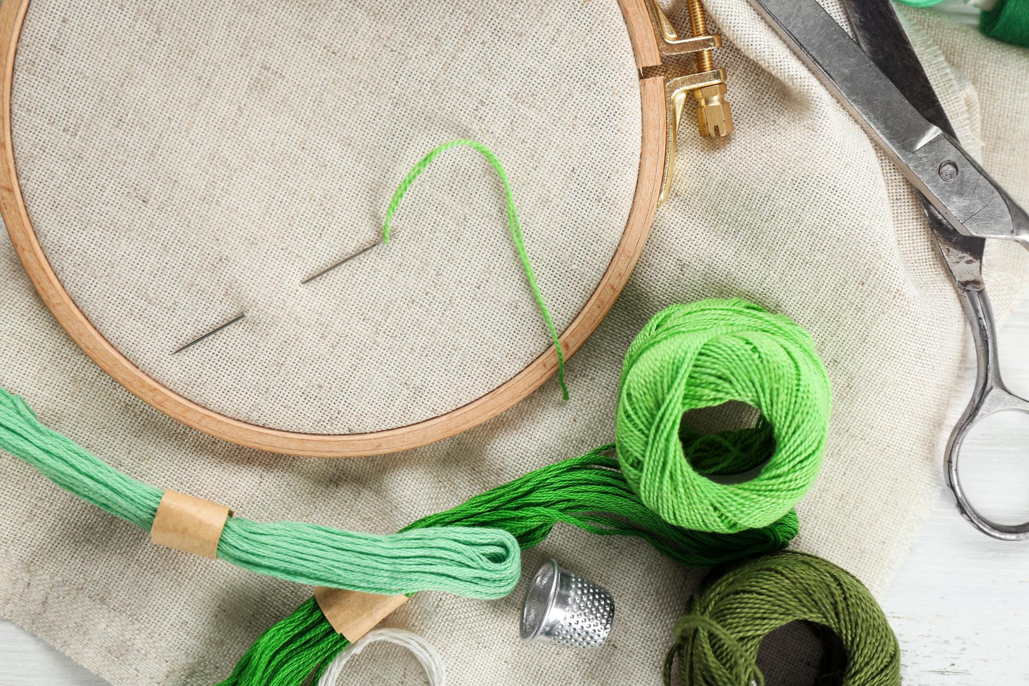 Studio workspace with hoops, threads and patterns
