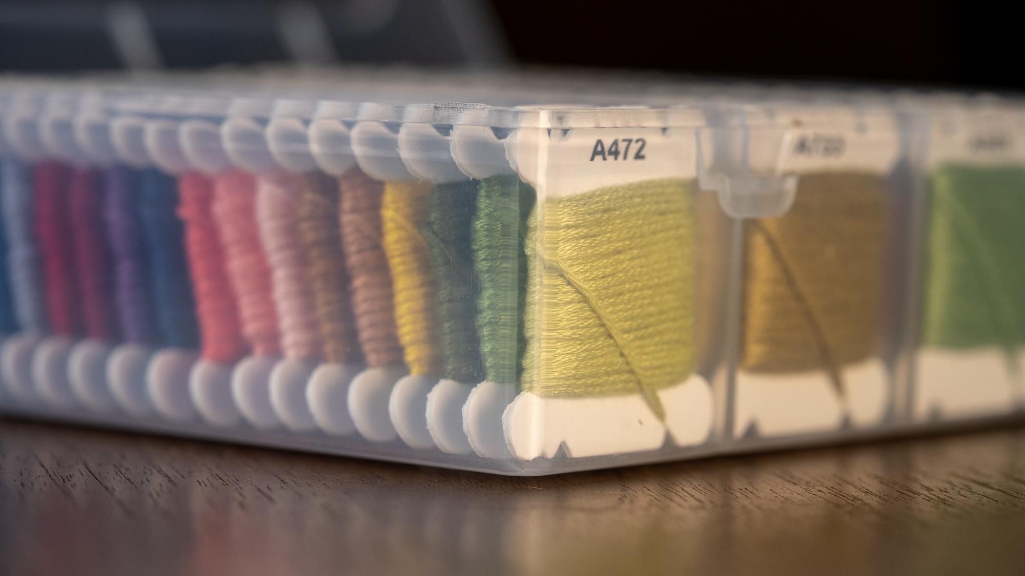 Overlapping photos of stitched samples and tech sheets