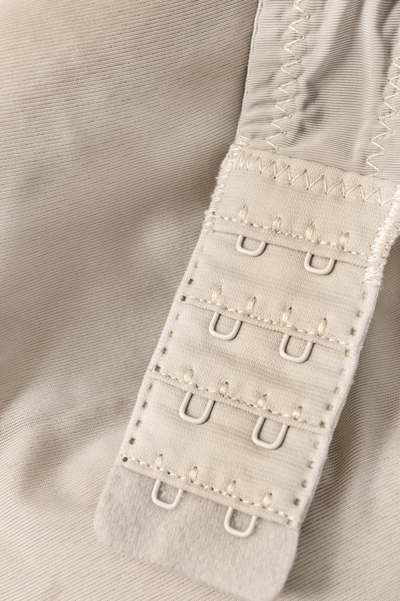 Close-up satin stitch monogram on cotton